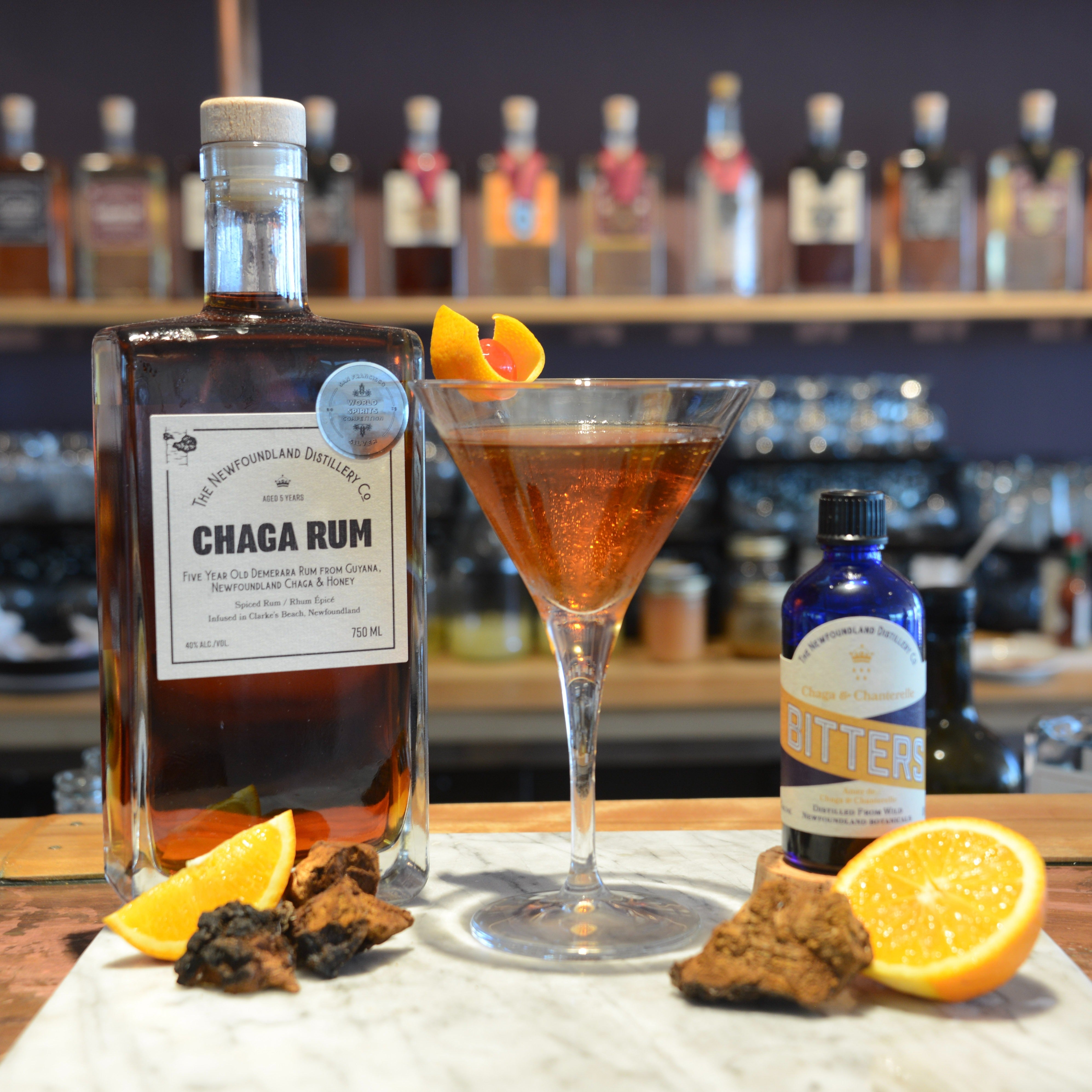 Rumhattan cocktail in a chilled glass garnished with orange peel