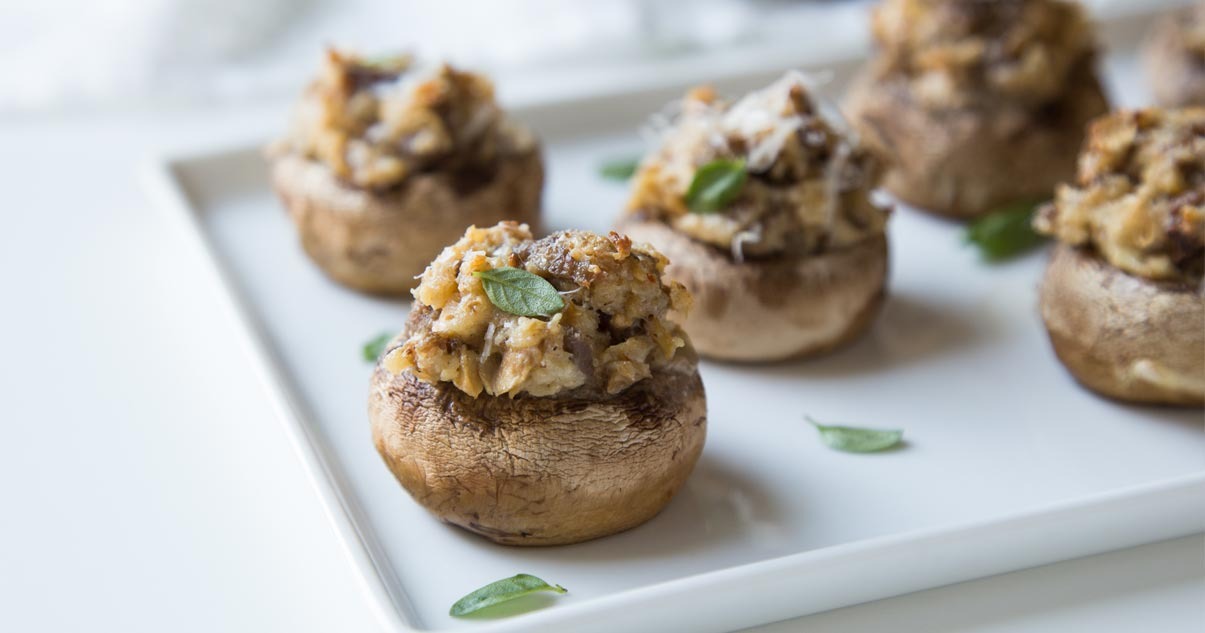Variety of gourmet mushrooms arranged on a wooden table